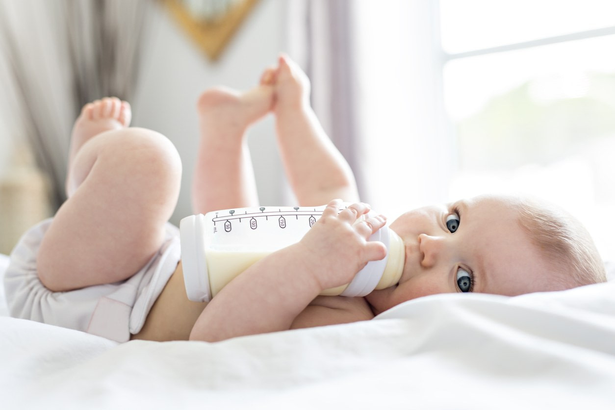 Baby with baby bottle