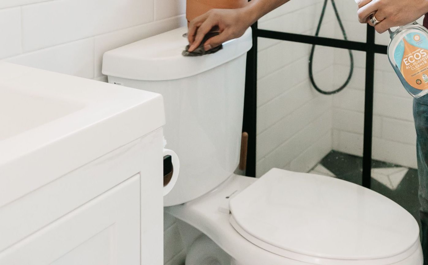 Man Cleaning Toilet